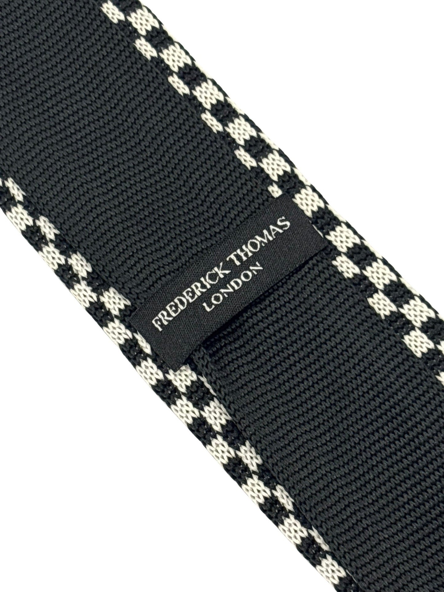 knitted tie with black and white check design