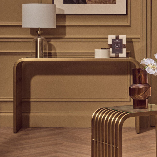 Matte Gold Slatted Console Table with Clear Glass Top | Vogue
