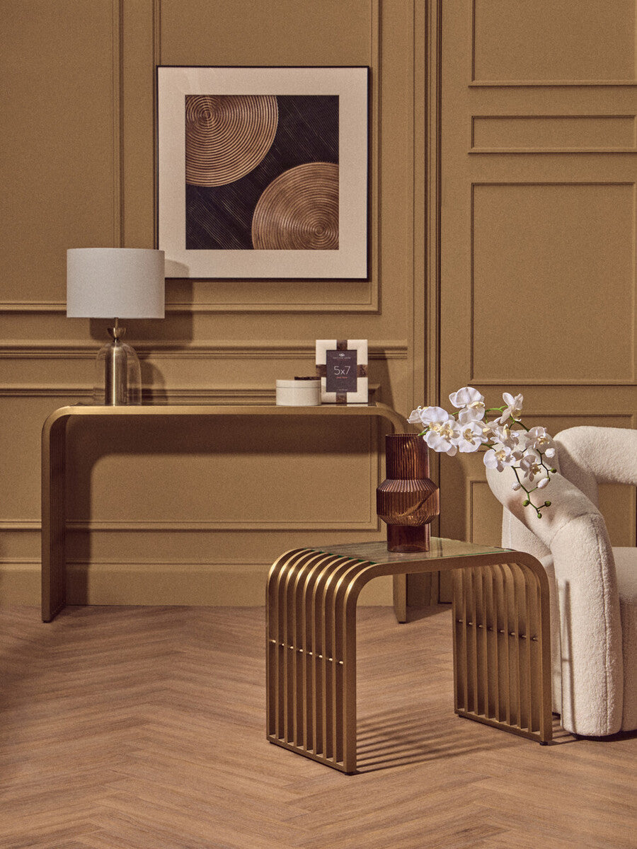 Matte Gold Slatted Console Table with Clear Glass Top | Vogue