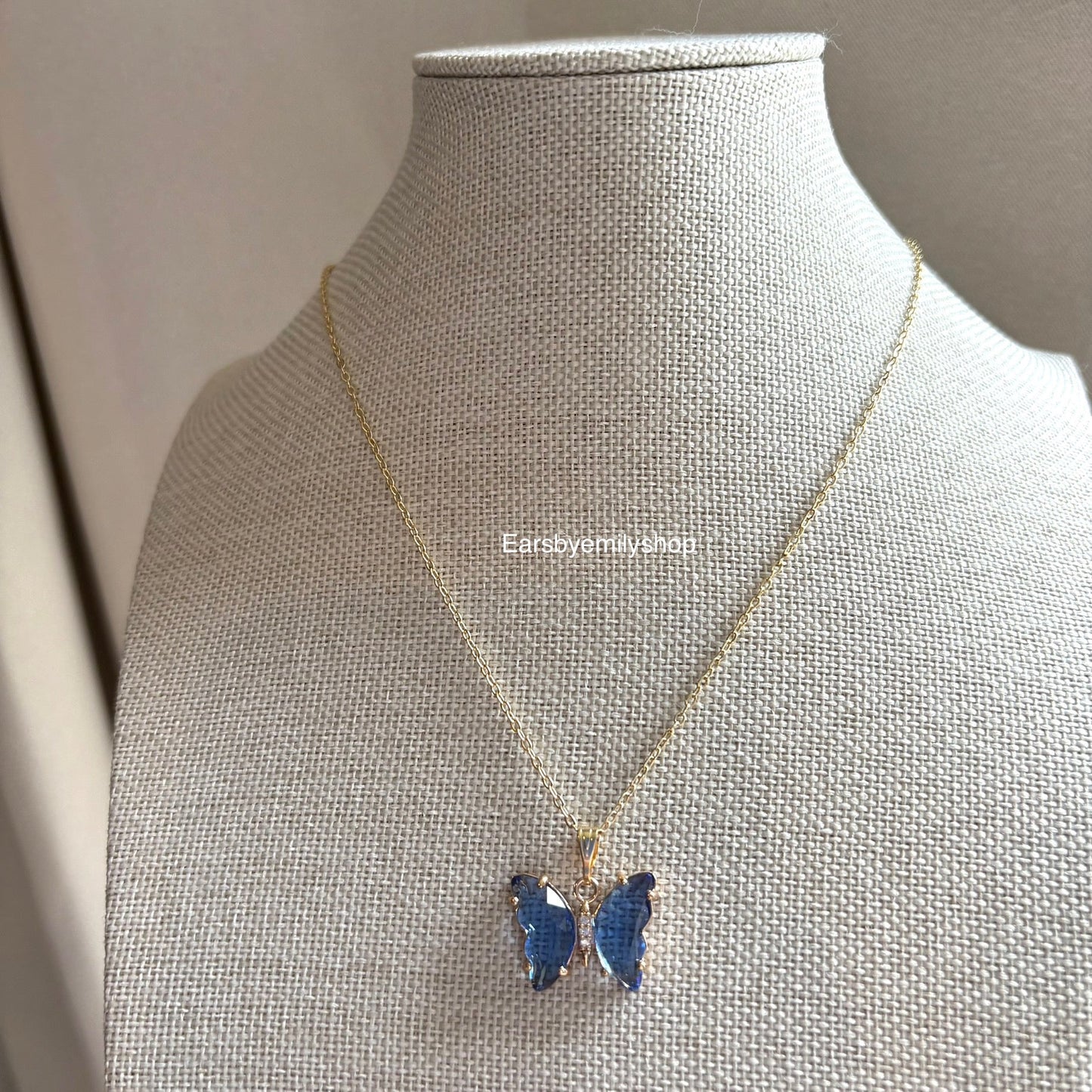 Cool blue crystal glass butterfly gold necklace
