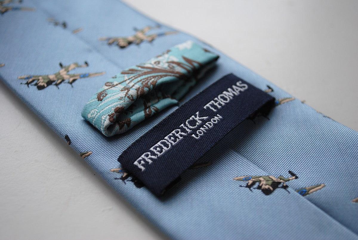 light blue tie with lancaster bomber pattern