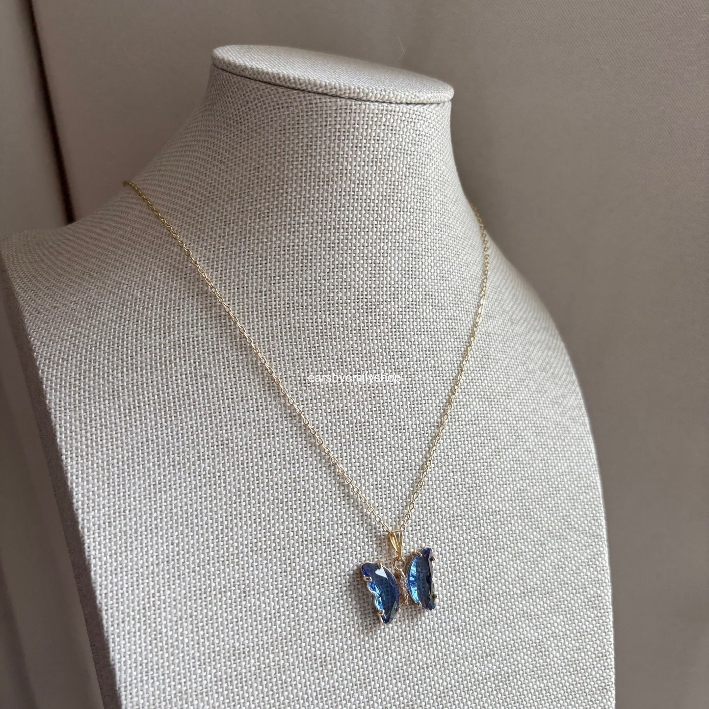 Cool blue crystal glass butterfly gold necklace