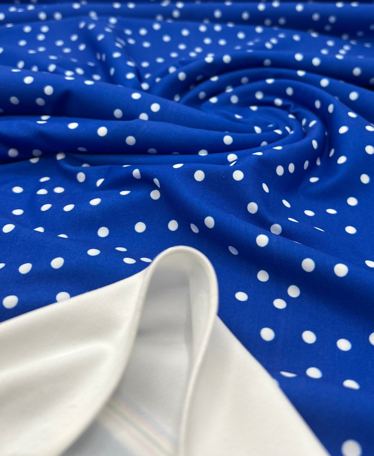 Blue Polka Stretch Jersey 220GSM 4 Way Stretch Fabric
