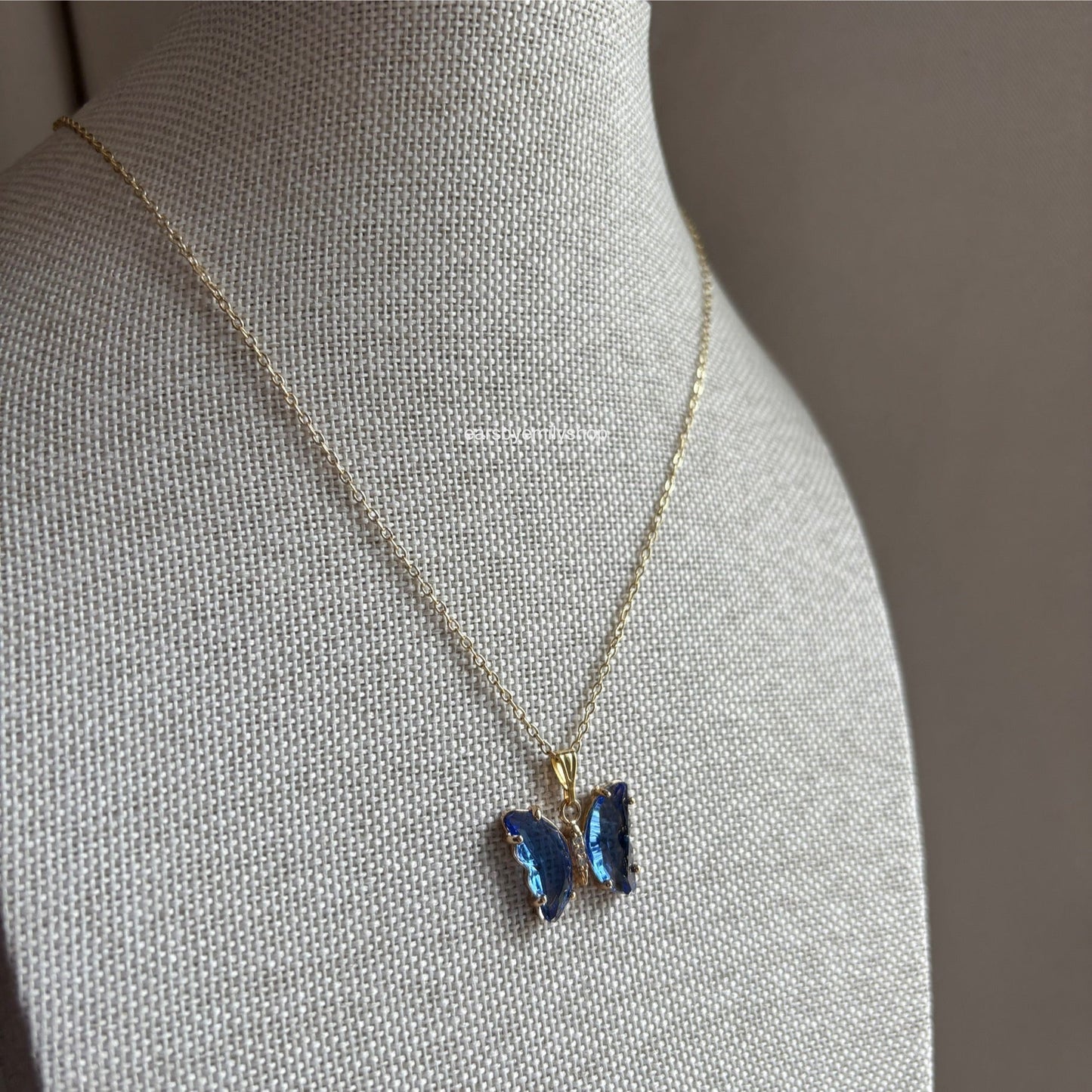 Cool blue crystal glass butterfly gold necklace