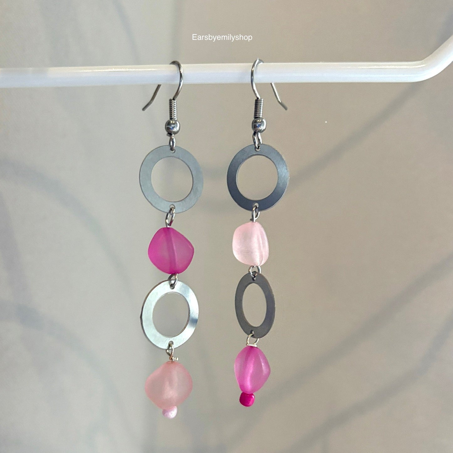 Stainless steel circle and asymmetrical pink bead statement dangle earrings