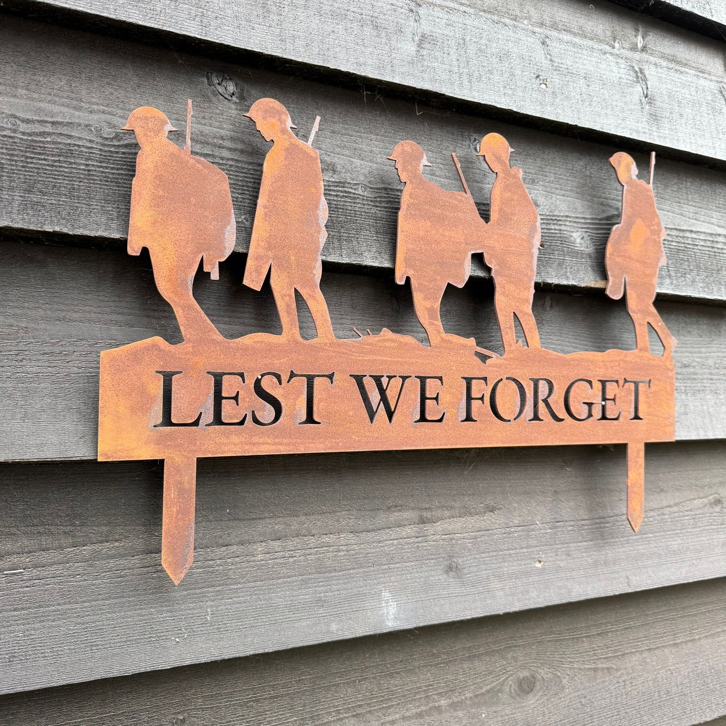 A Rusty Metal Lest We Forget Soldier Scene Garden Decoration