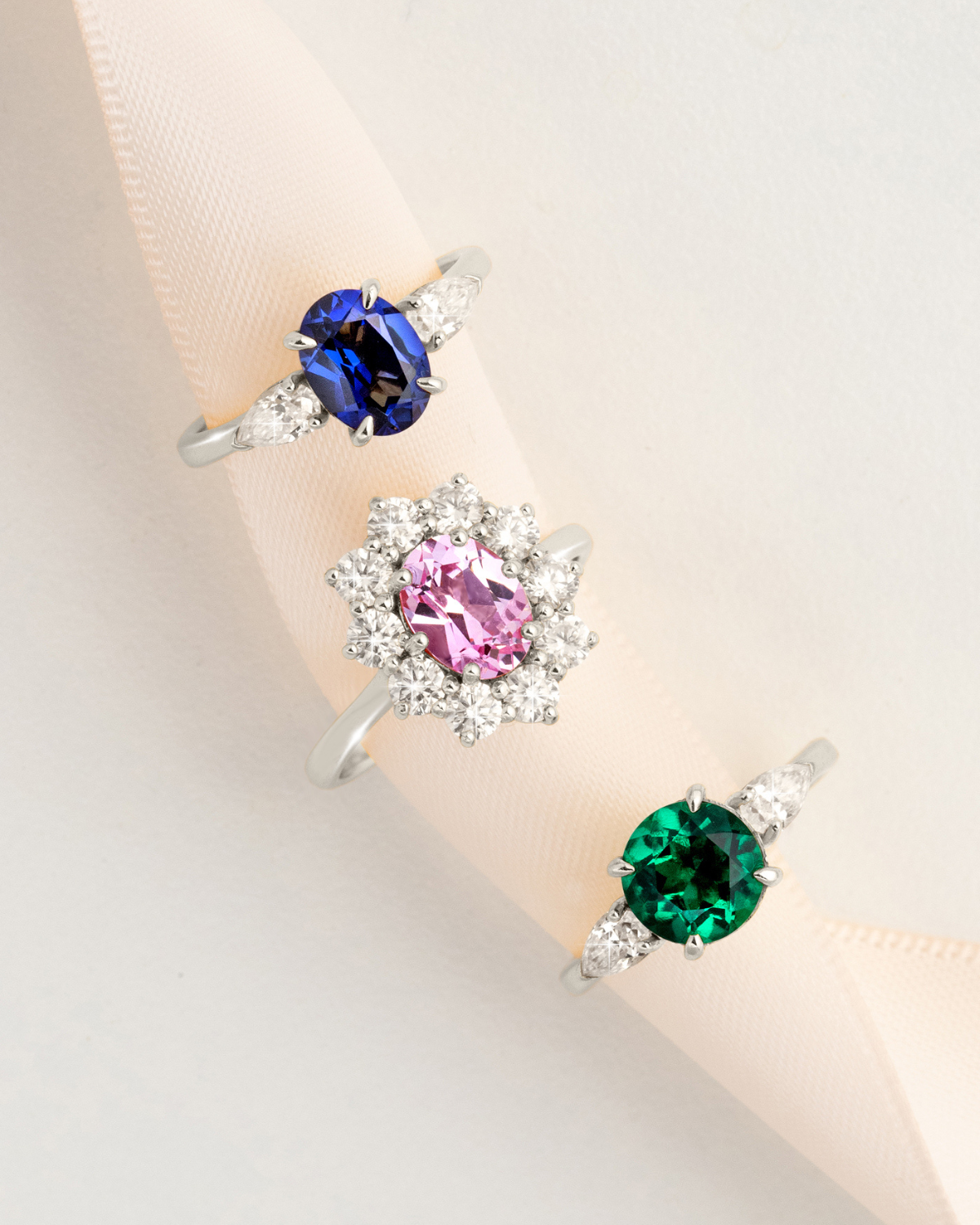 Emerald Round Cut Three Stone Engagement Ring in Sterling Silver