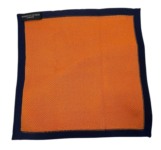 orange knitted pocket square with navy dark blue edging
