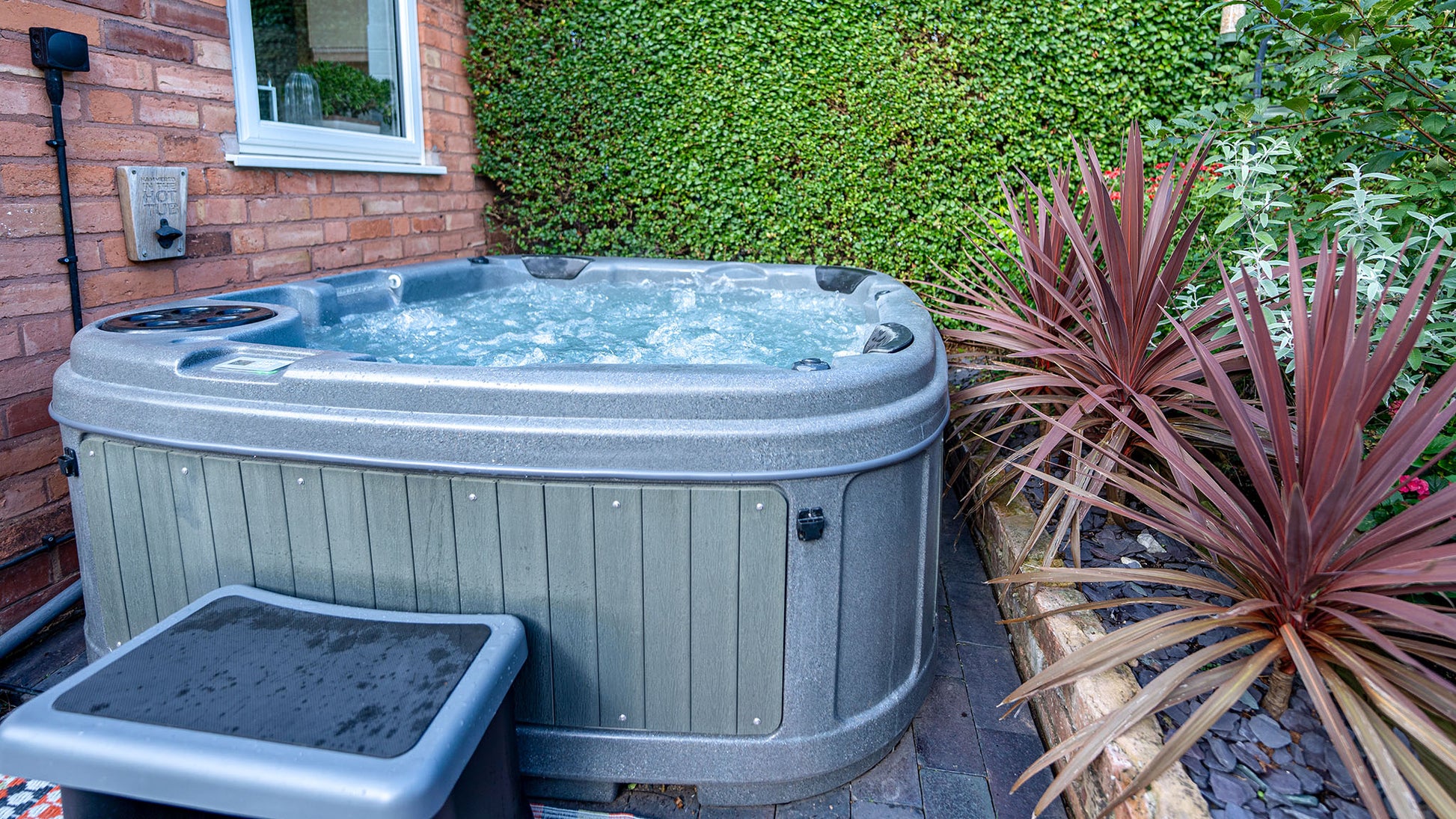TheFoalyard RotoSpa DuraSpa S380 hot tub Granite Grey with Dark Grey panels 5 6 persons - side house easy install