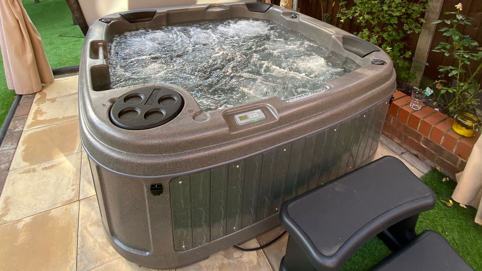 TheFoalyard RotoSpa DuraSpa S380 hot tub Granite Grey with Dark Grey panels 5 6 persons - under pergola