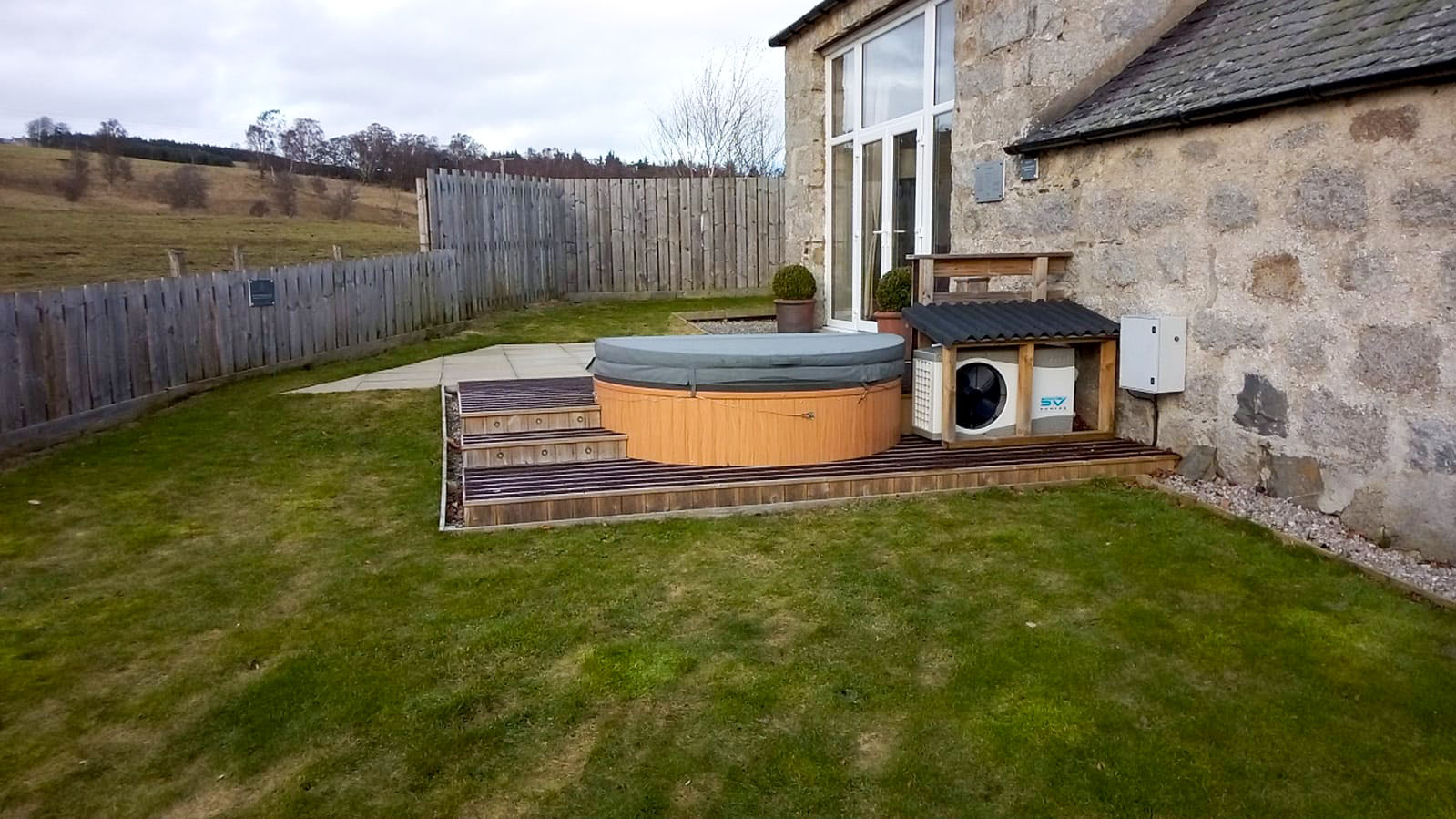 TheFoalyard RotoSpa QuatroSpa British made hot tub Granite Grey shell with Teak panels 5 6 persons - built-in deck jacuzzi