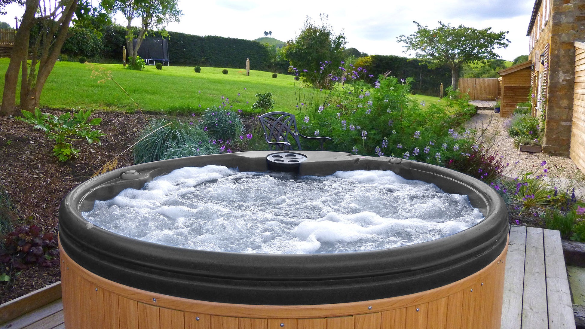 TheFoalyard RotoSpa QuatroSpa British made hot tub Granite Grey shell with Teak panels 5 6 persons - jacuzzi back garden
