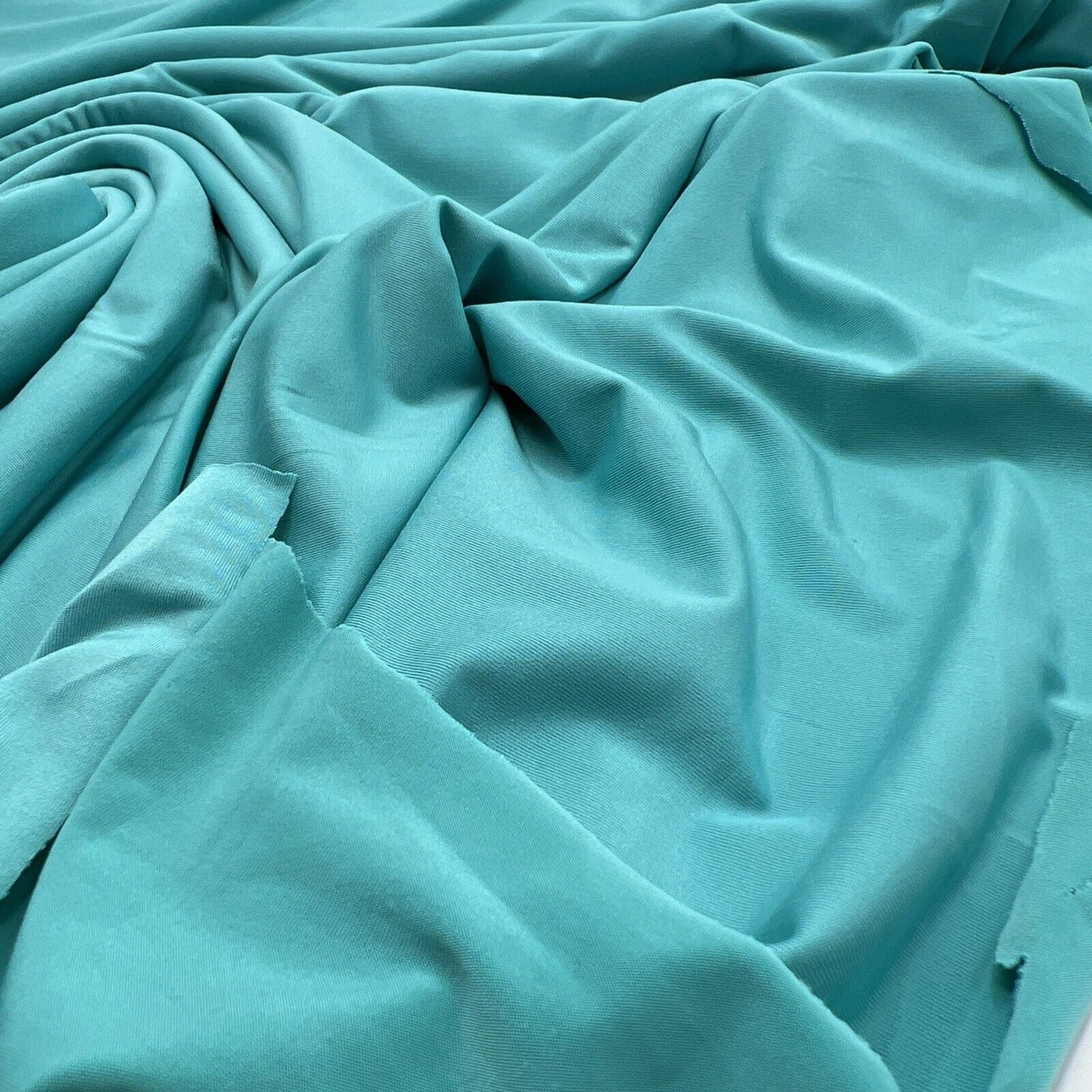 Aqua Blue Plain Shiny Soft Touch Slinky 4 Way Stretch Fabric