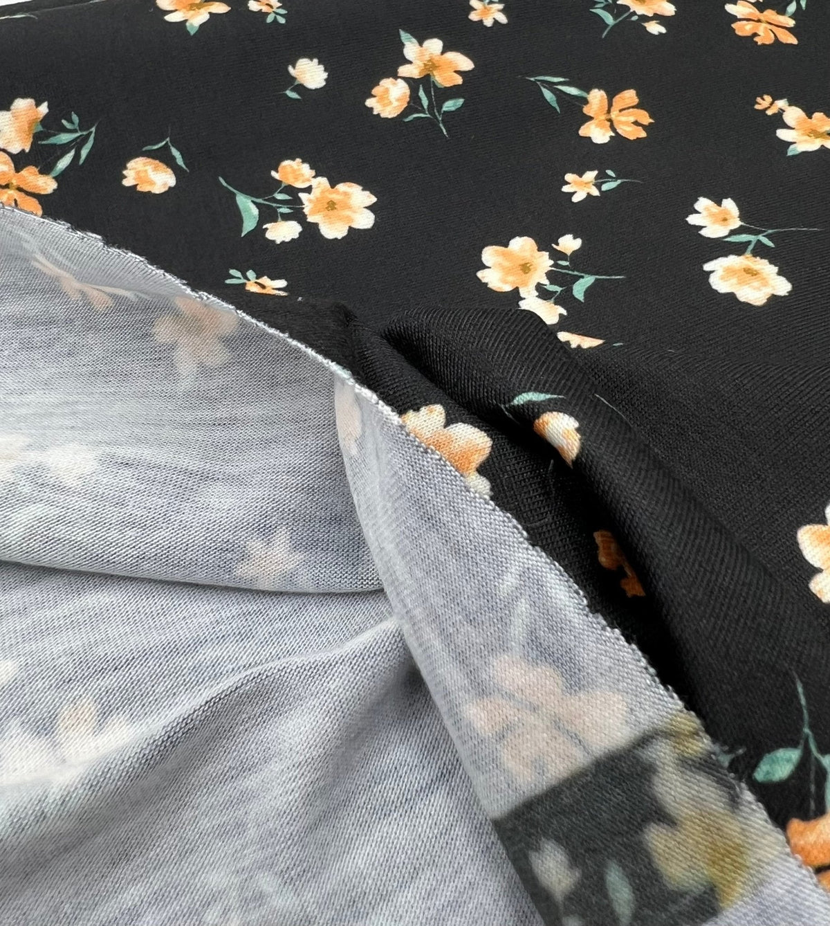 Black Orange Ditsy Floral Print Soft Spun Poly Stretch Fabric