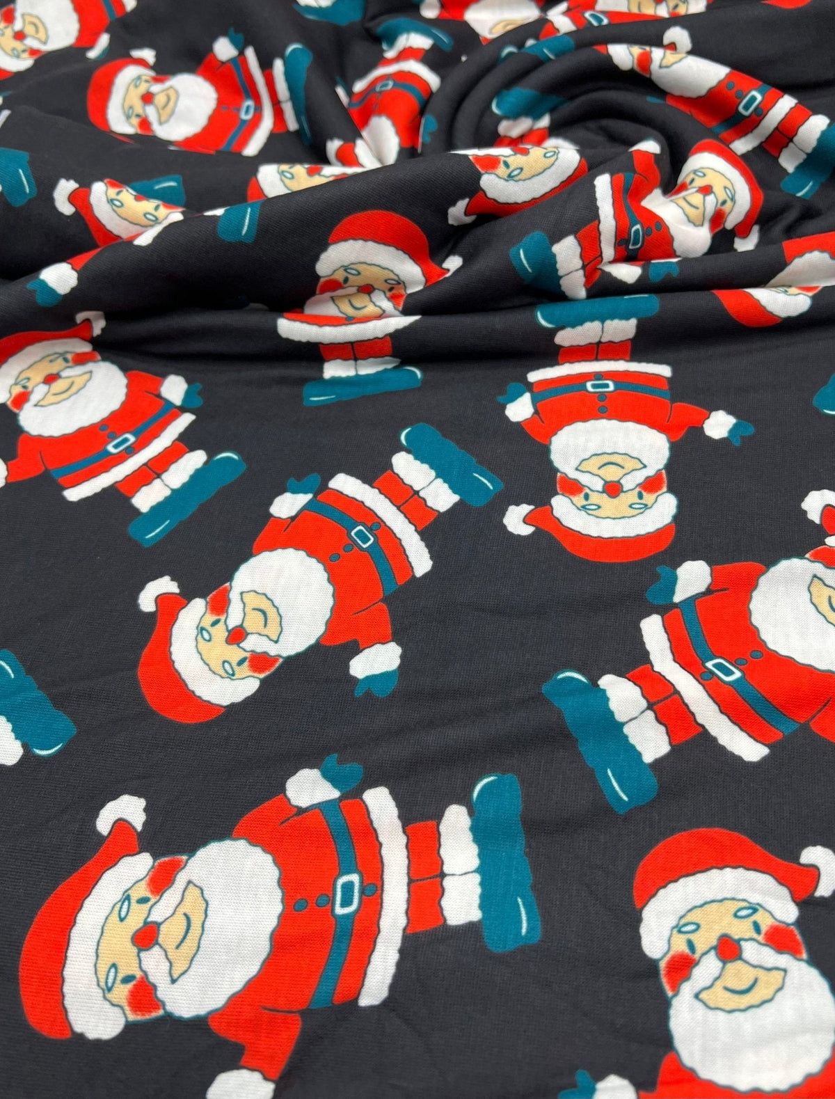 Black Rosy Cheek Santa Print Soft Spun Poly Stretch Fabric