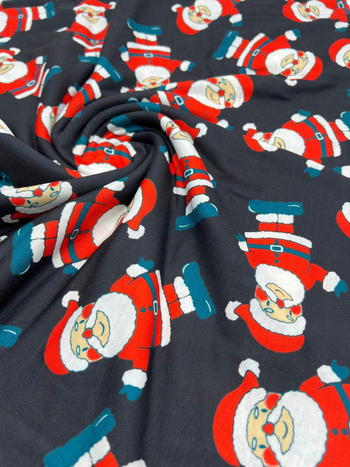 Black Rosy Cheek Santa Print Soft Spun Poly Stretch Fabric
