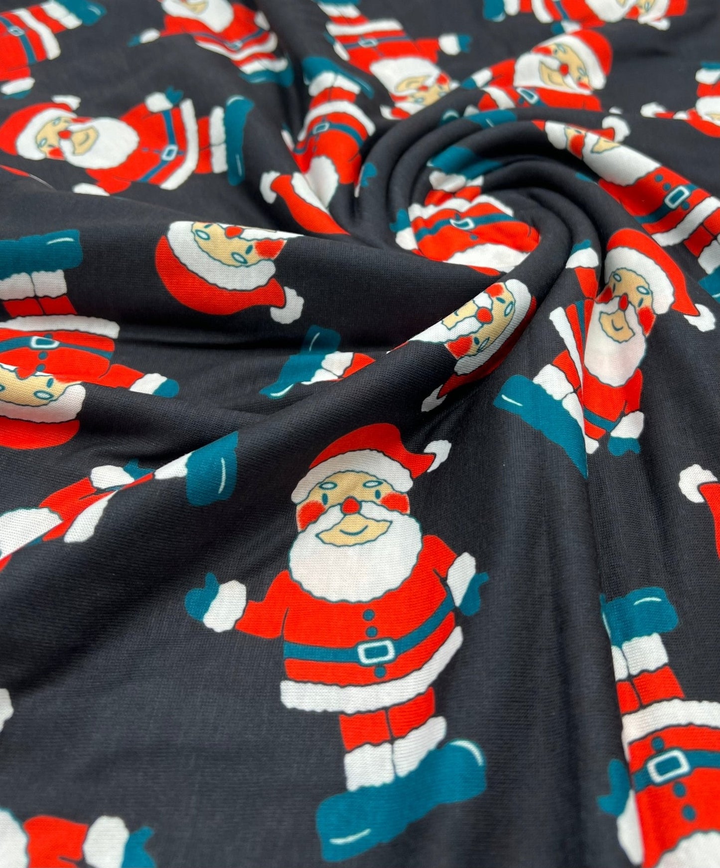Black Rosy Cheek Santa Print Soft Spun Poly Stretch Fabric