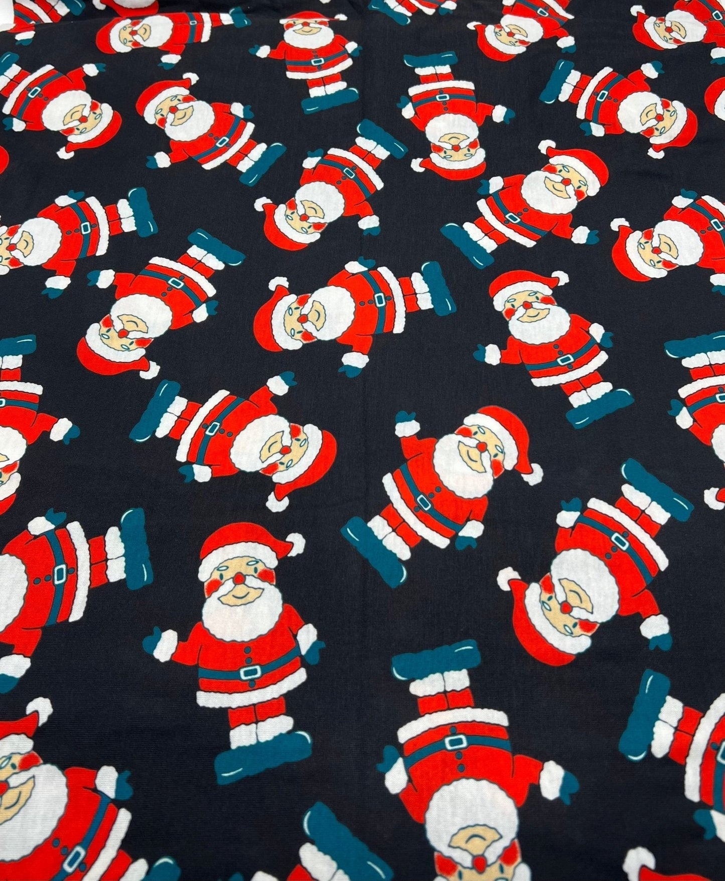Black Rosy Cheek Santa Print Soft Spun Poly Stretch Fabric