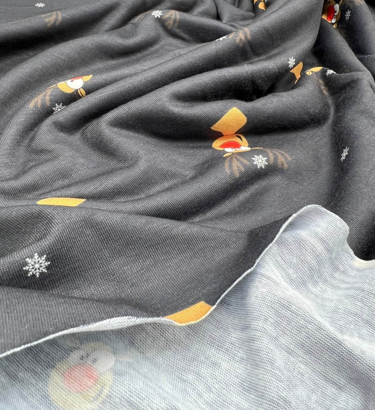Black Rudolph Print Soft Spun Poly Stretch Fabric