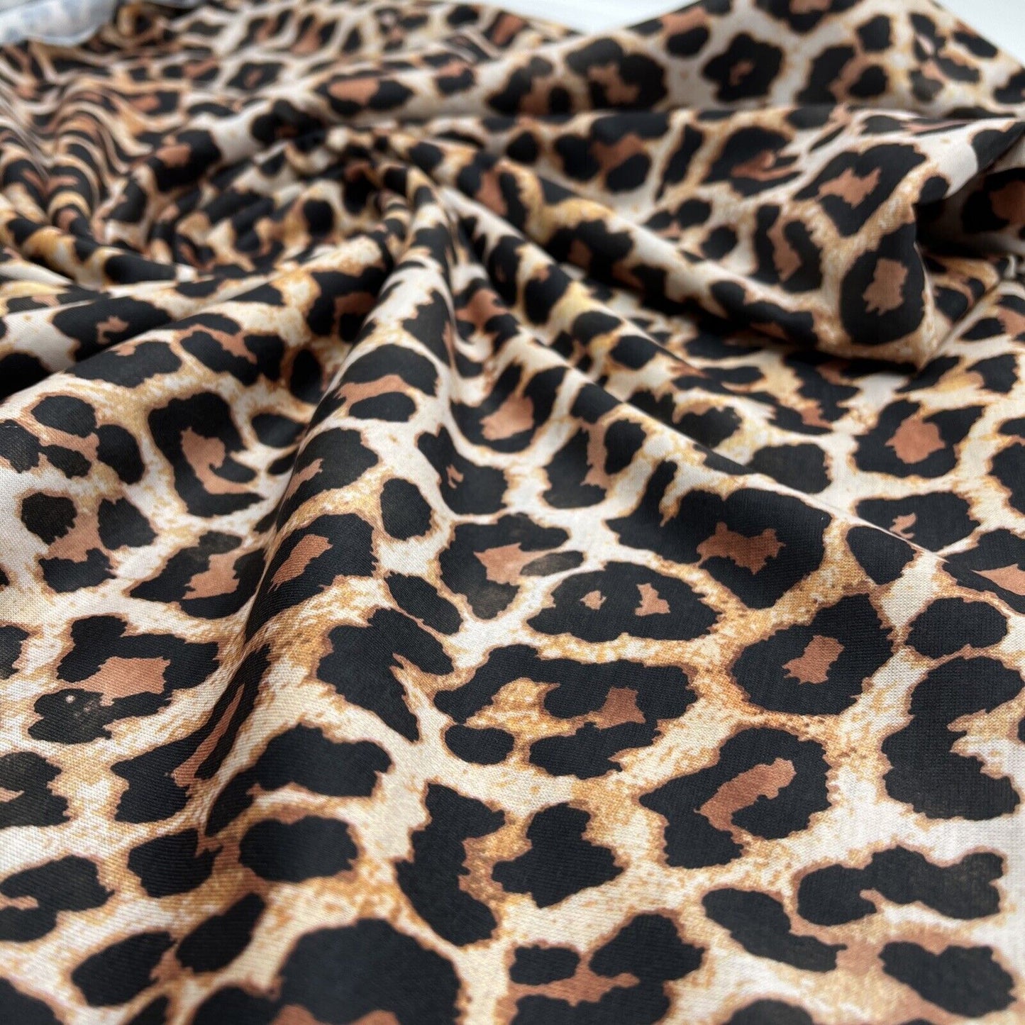 Black Tan Animal Print Spun Poly Stretch Fabric