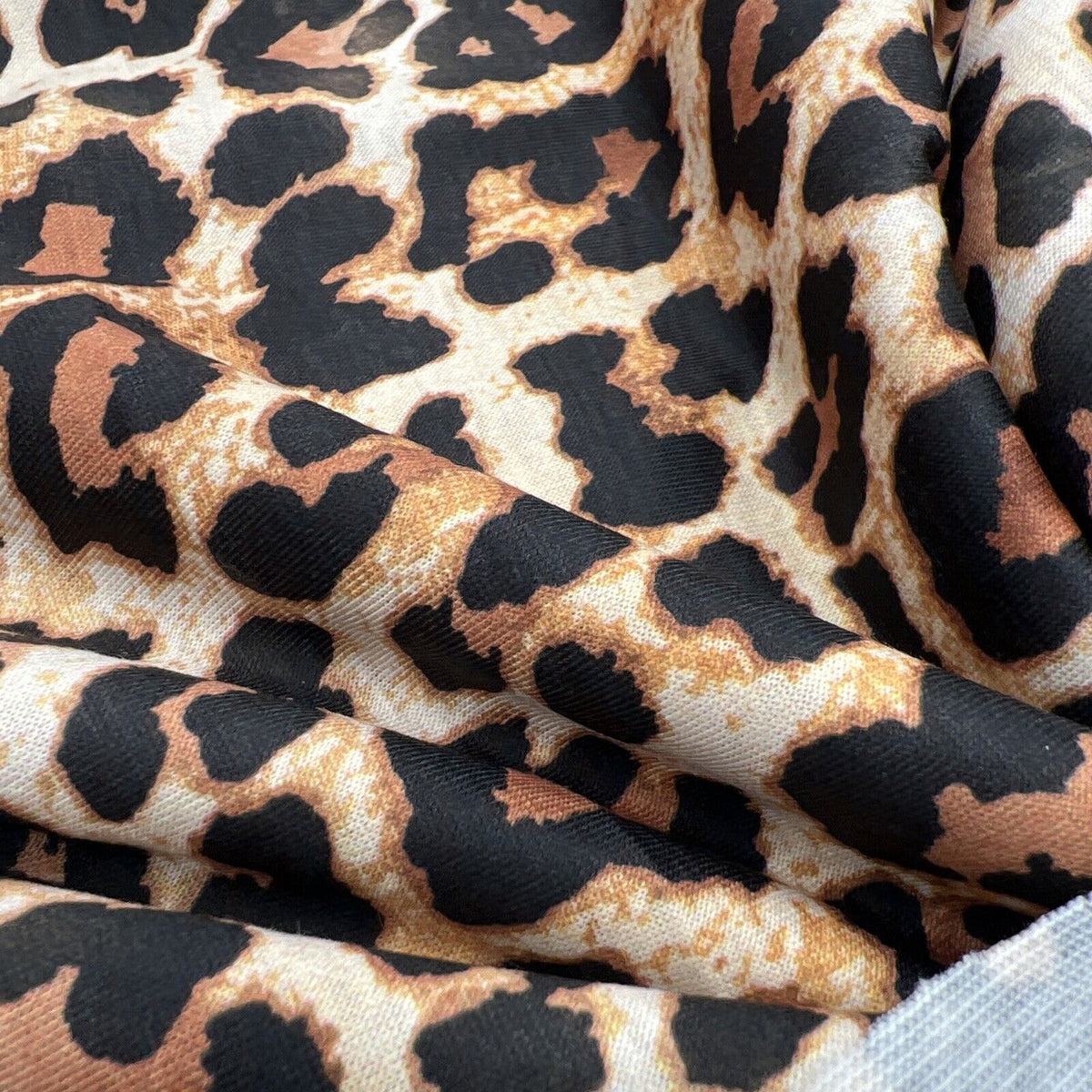 Black Tan Animal Print Spun Poly Stretch Fabric