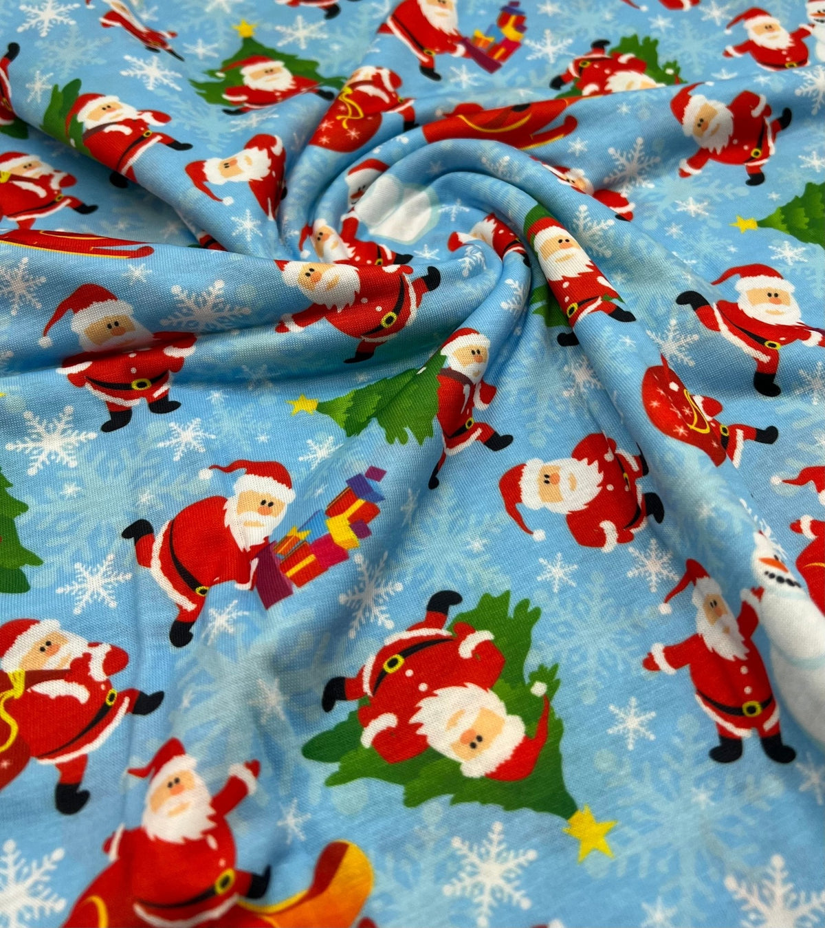 Blue Santa Sledge Print Soft Spun Poly Stretch Fabric