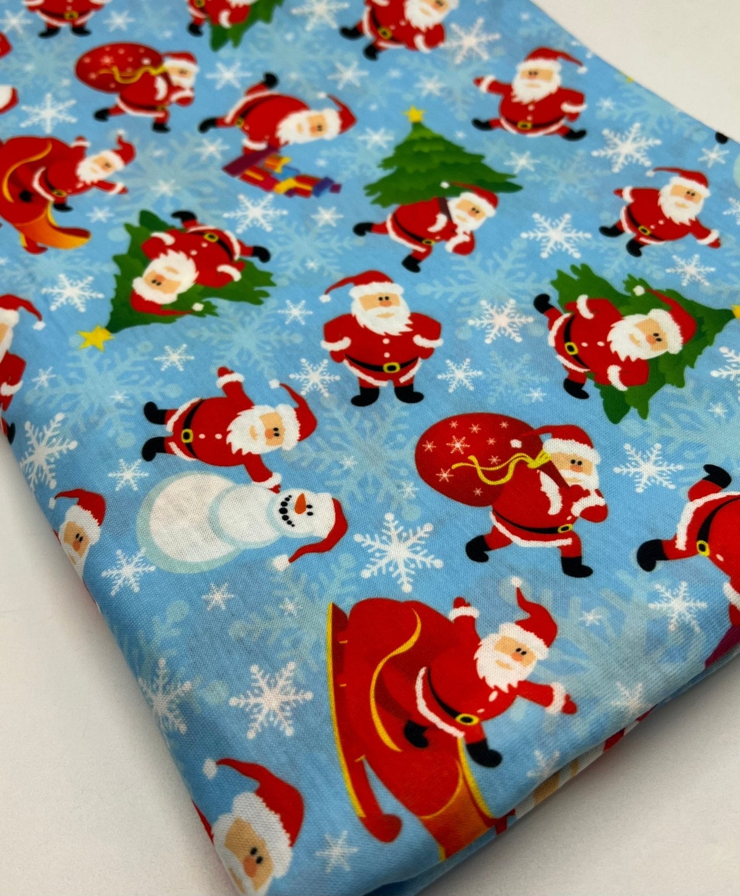 Blue Santa Sledge Print Soft Spun Poly Stretch Fabric
