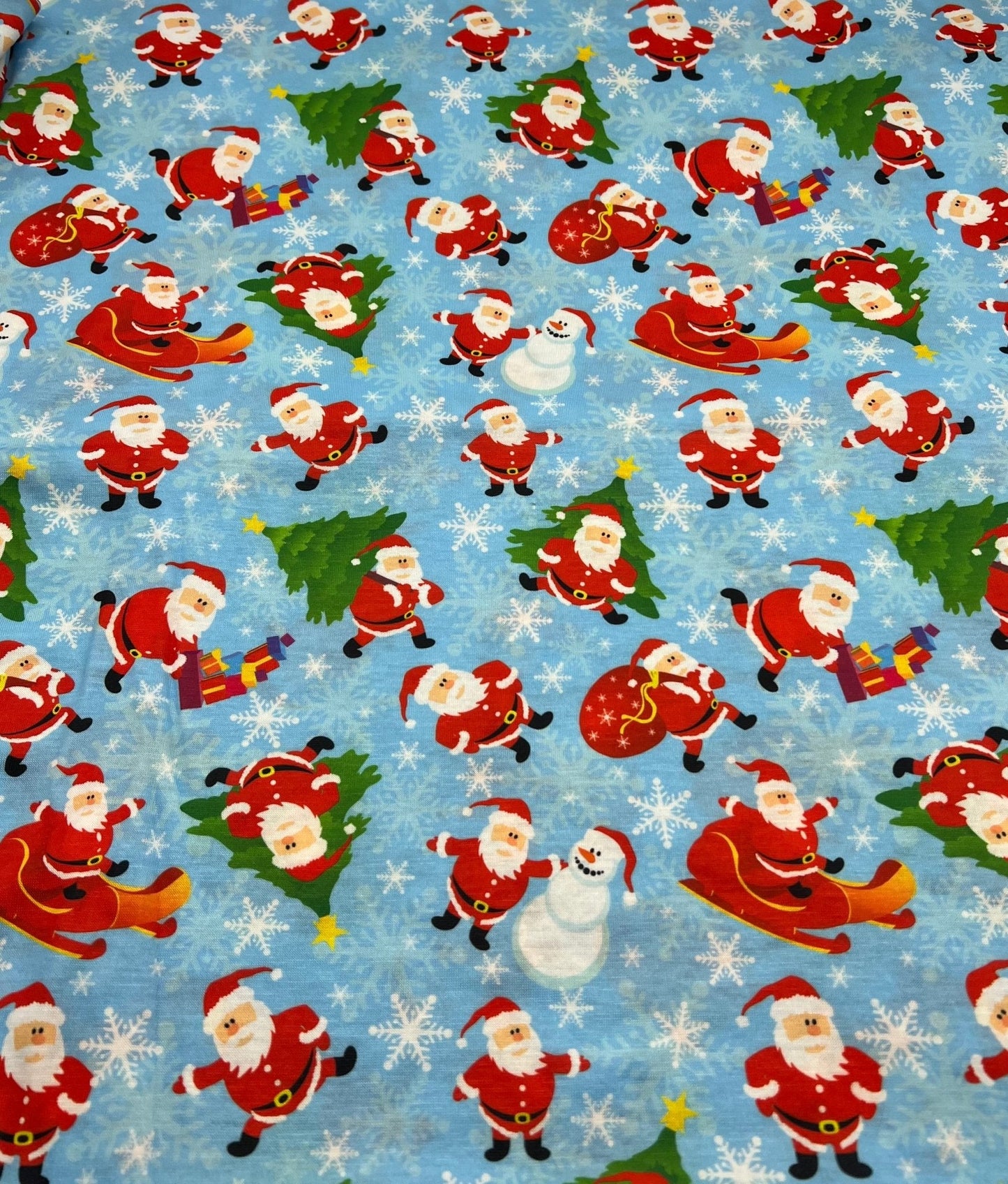 Blue Santa Sledge Print Soft Spun Poly Stretch Fabric