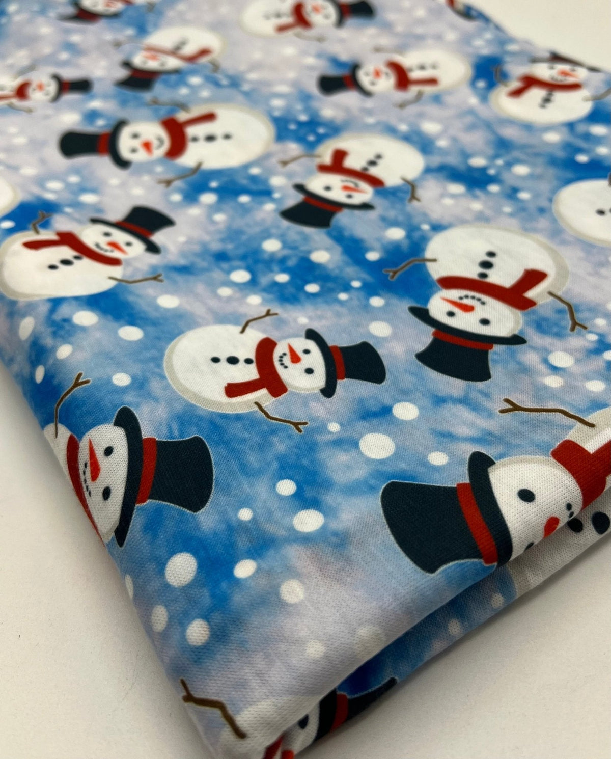 Blue Snow Snowman Print Soft Spun Poly Stretch Fabric