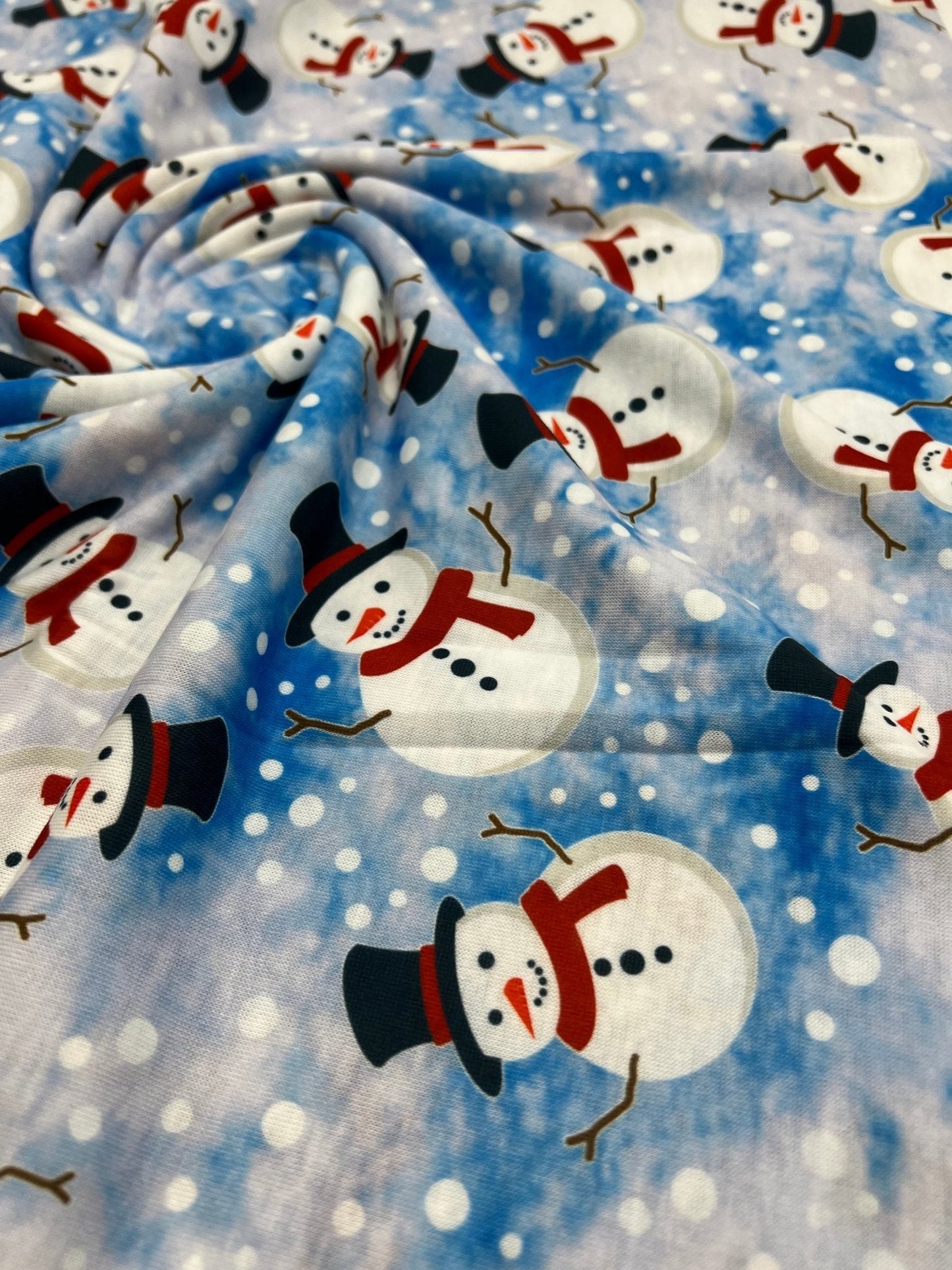 Blue Snow Snowman Print Soft Spun Poly Stretch Fabric