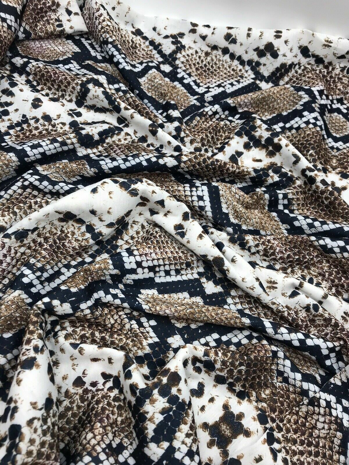 Brown Snakeskin Print Spun Poly Stretch Fabric