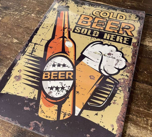 Vintage cold beer sold here metal sign