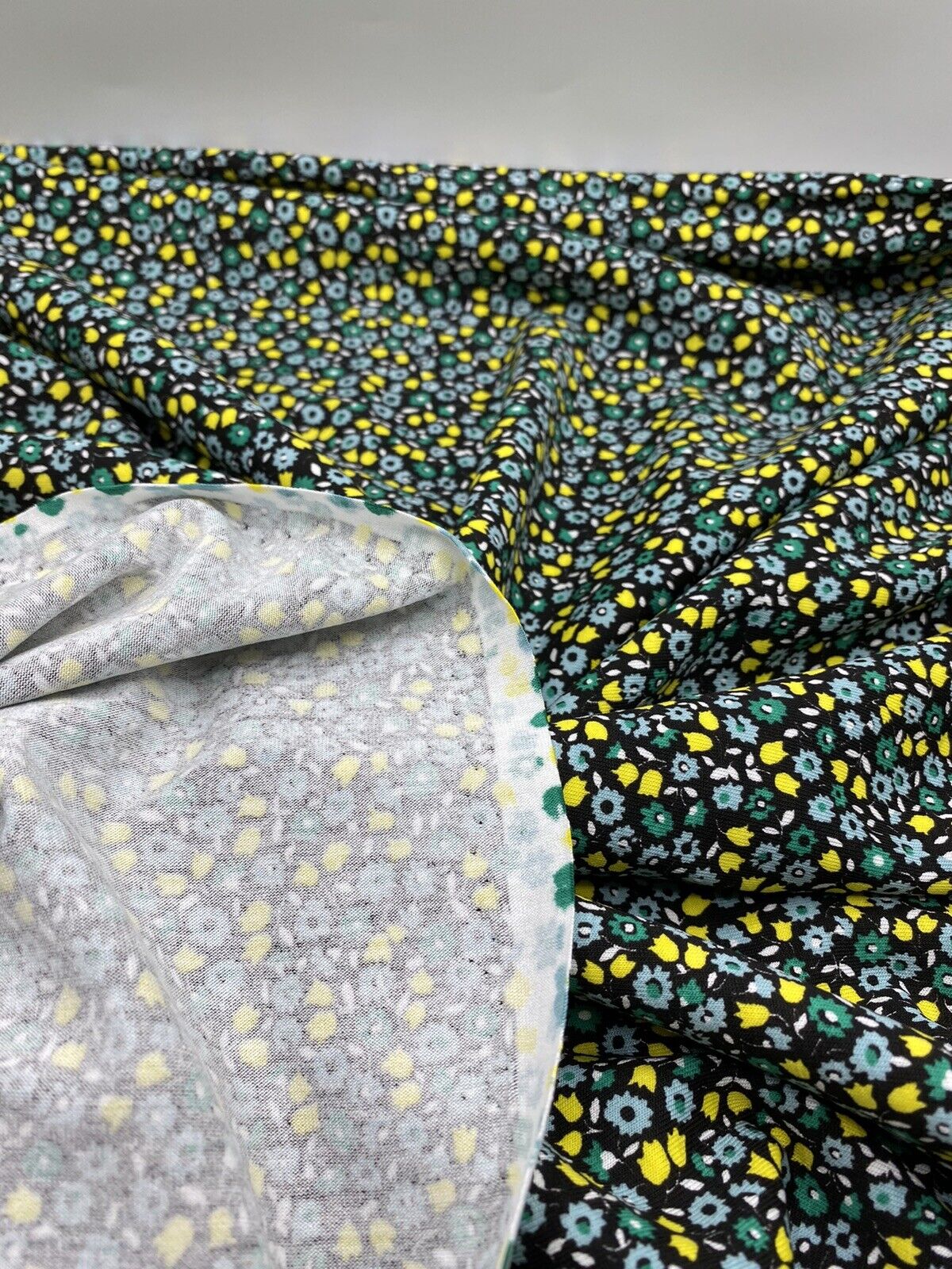 Ditsy Green & Yellow On Black Floral Print Viscose Elastane Fabric