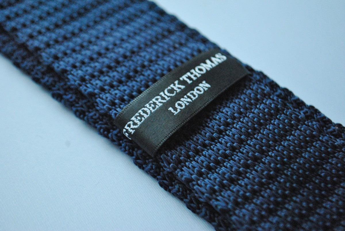 navy blue skinny knitted tie with bright pink polka dots