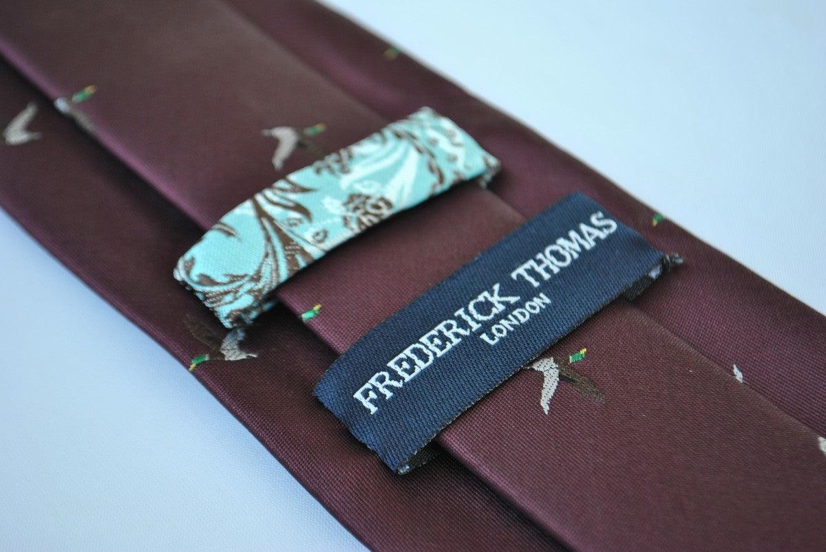 maroon tie with flying duck design