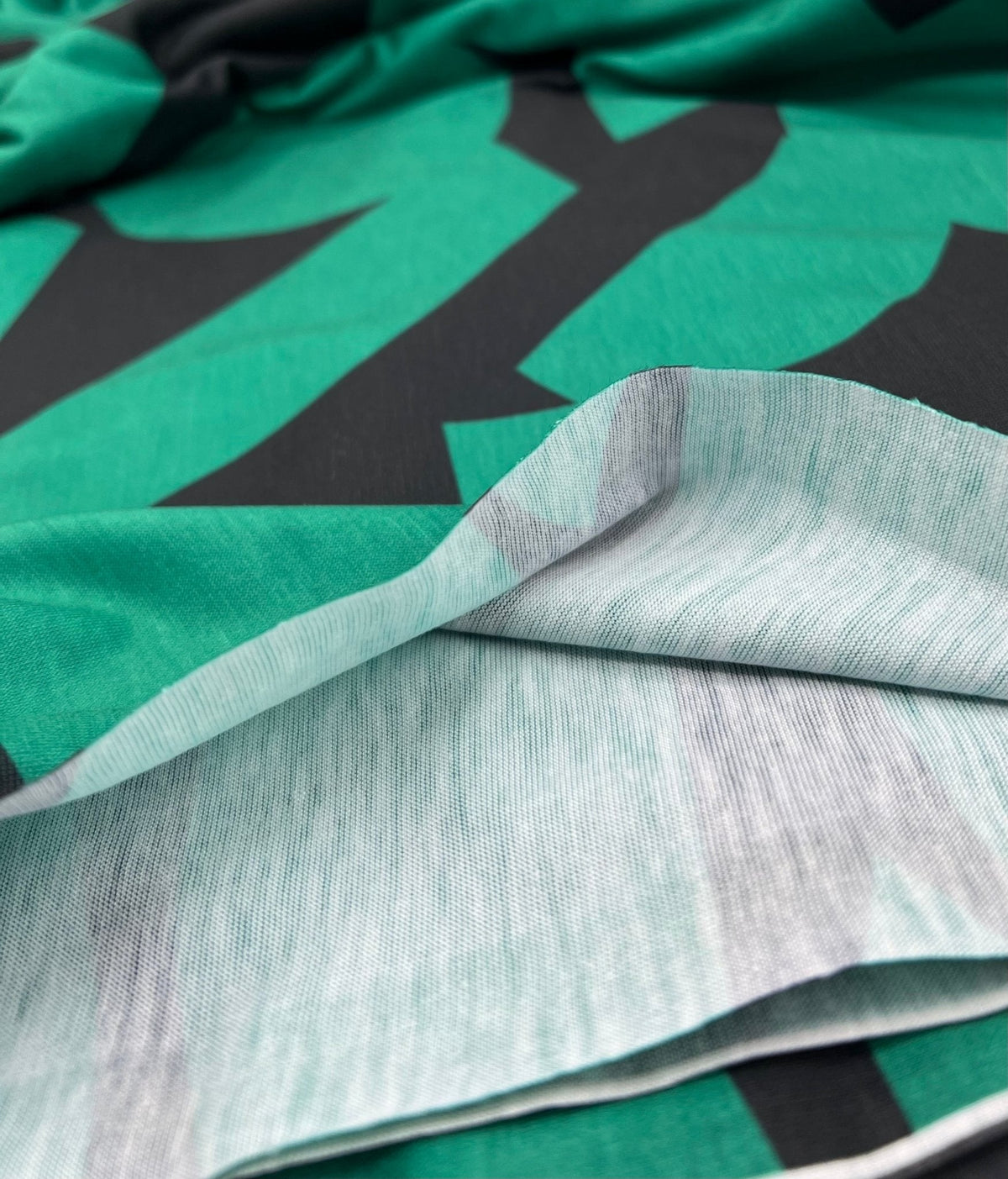Green Black Spun Poly Stretch Fabric