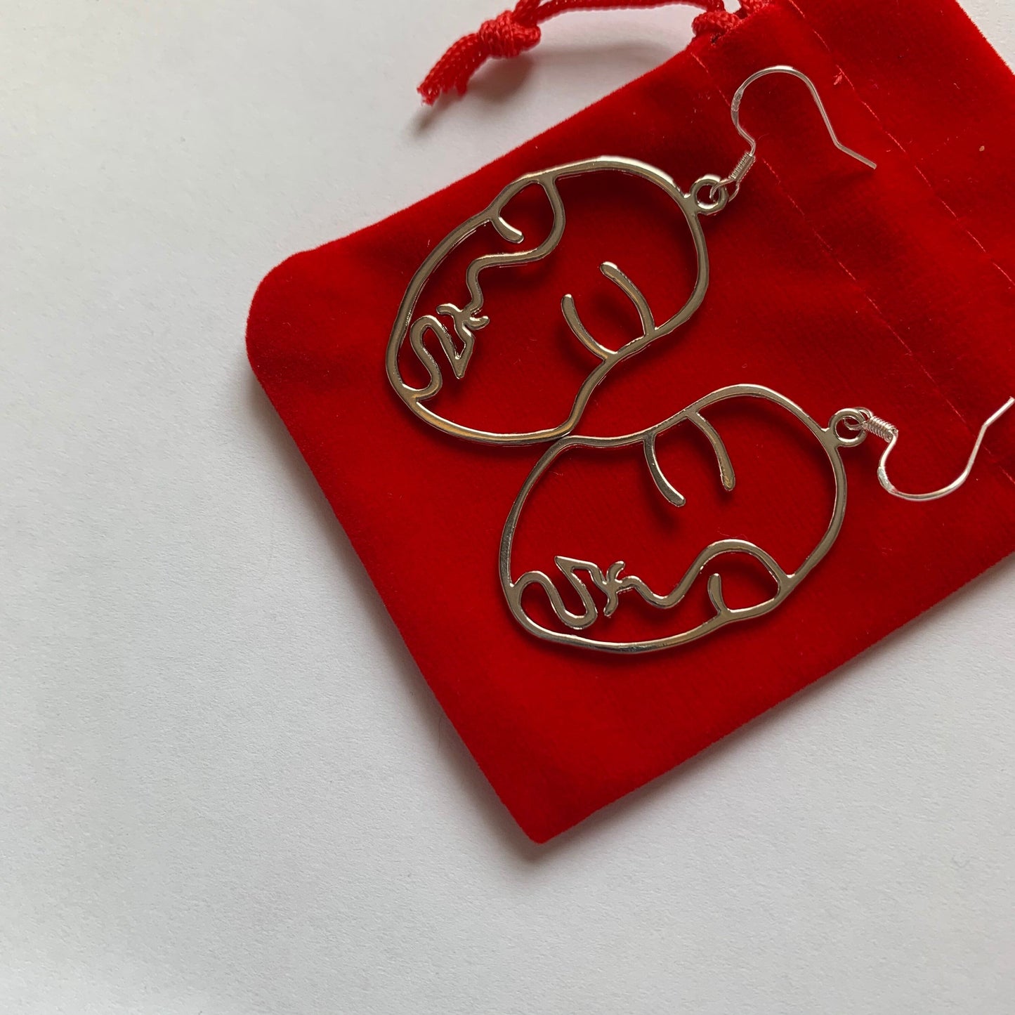 Silver or gold face outline earrings