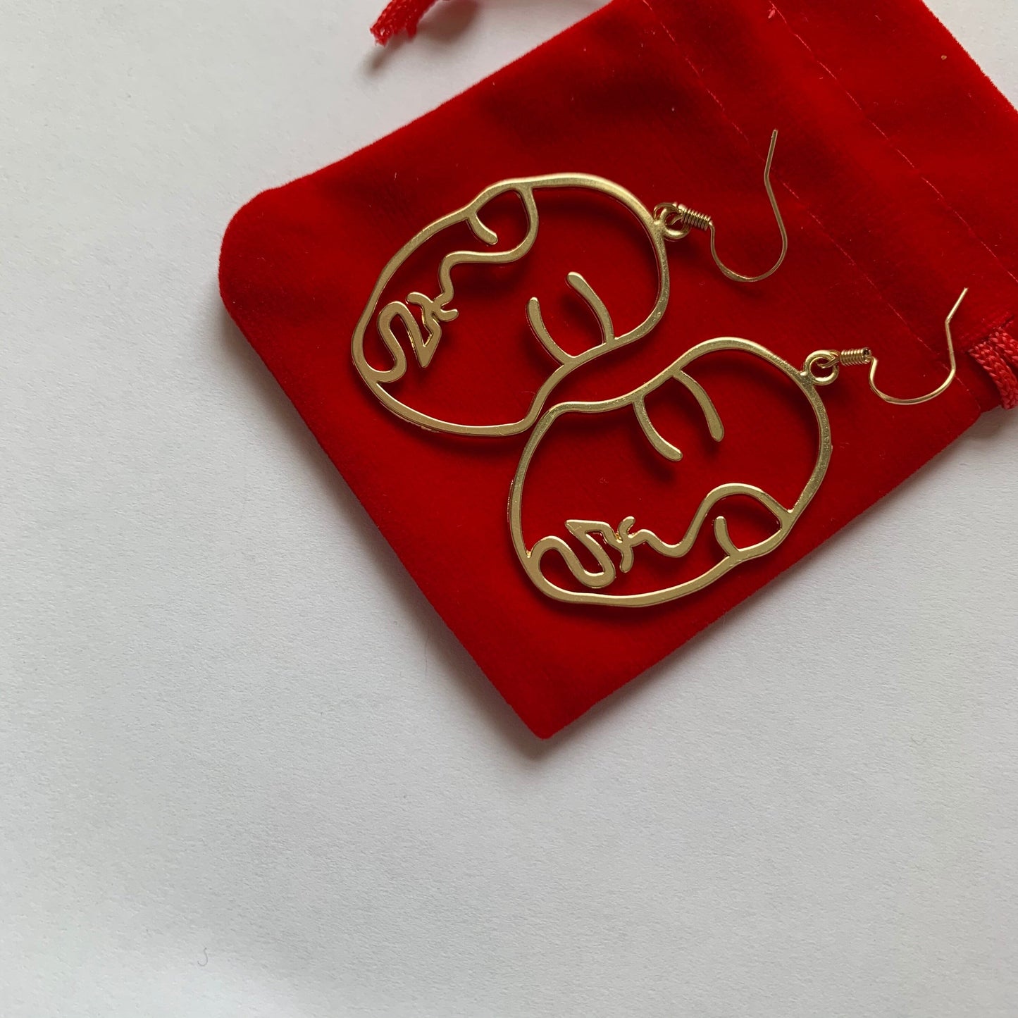 Silver or gold face outline earrings