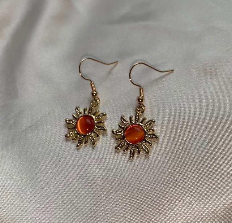 Cool quirky gold orange sun earrings with orange centre dangle earrings