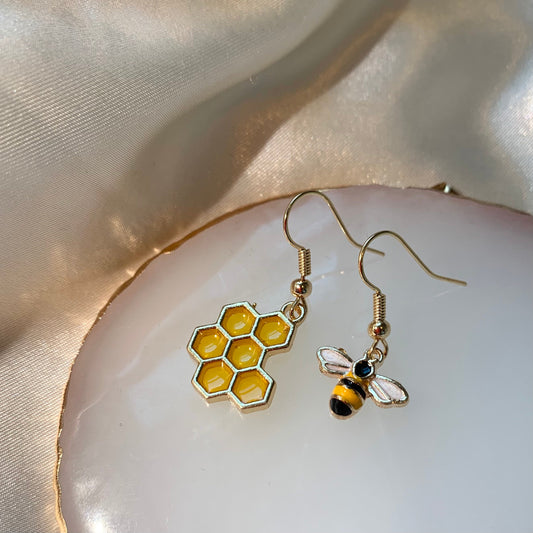 Cool quirky yellow and black gold bee drop dangle earrings with yellow honey comb