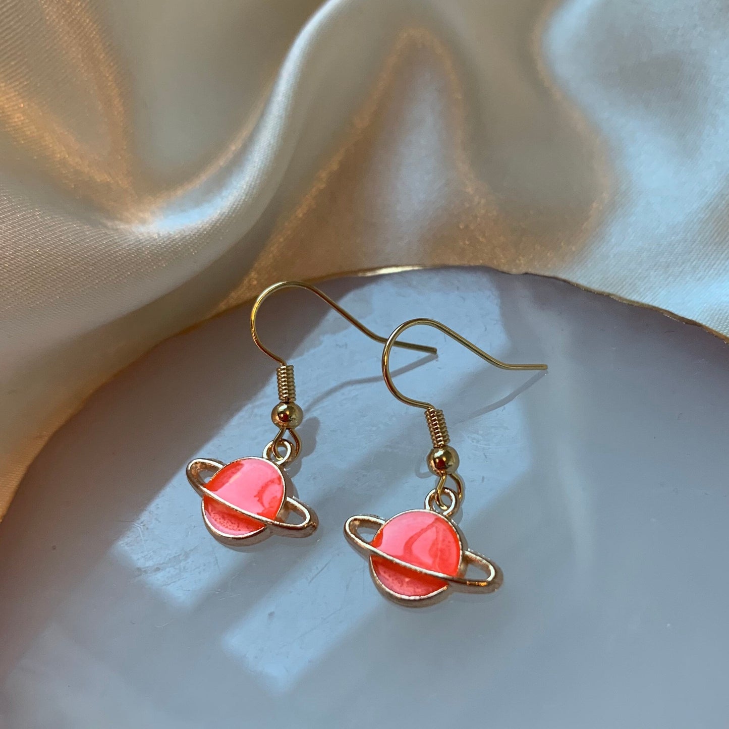 Cool quirky little blue or pink saturn planet drop dangle earrings