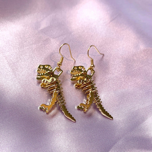 Gold dinosaur t-Rex skeleton earrings