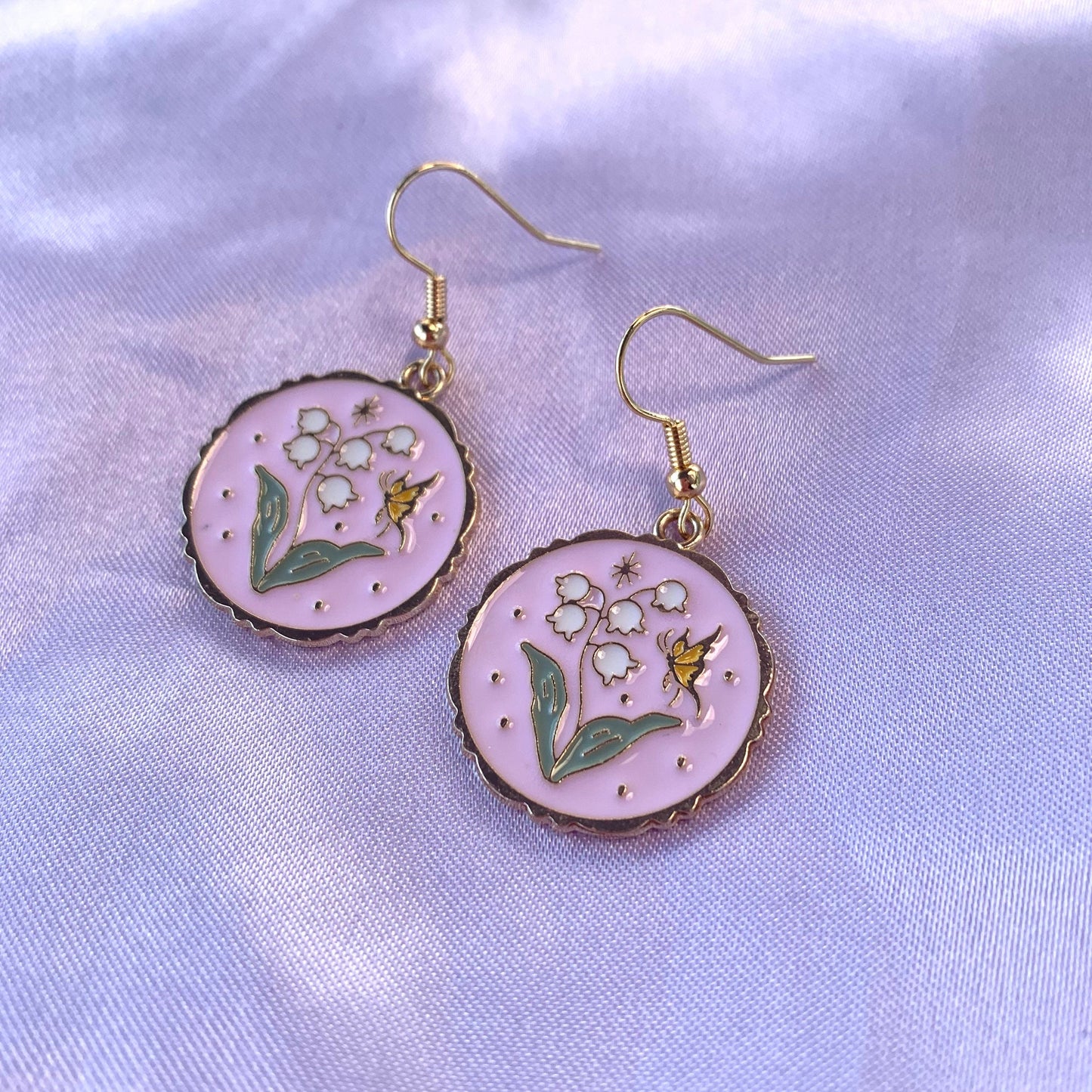 Pink circle with flowers and butterfly dangle gold earrings