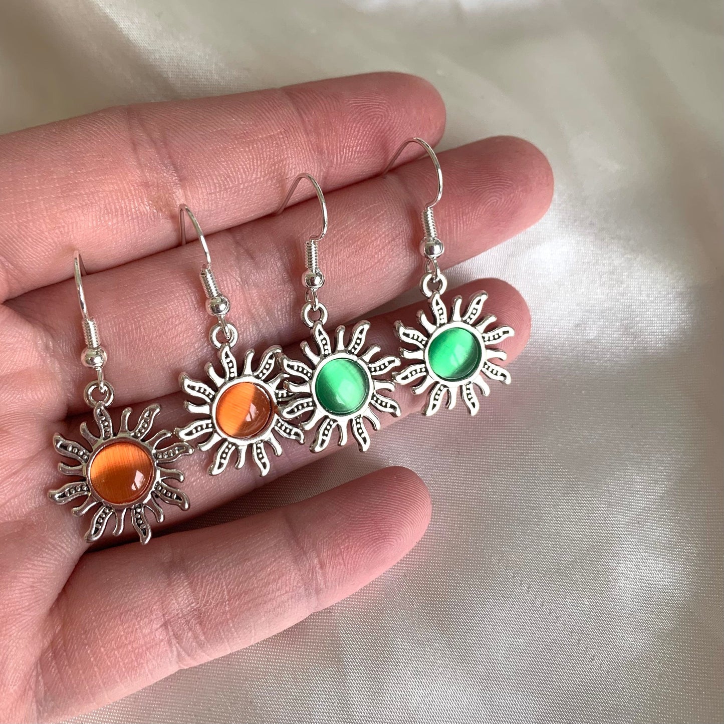Silver orange or green centre feature sun drop dangle earrings