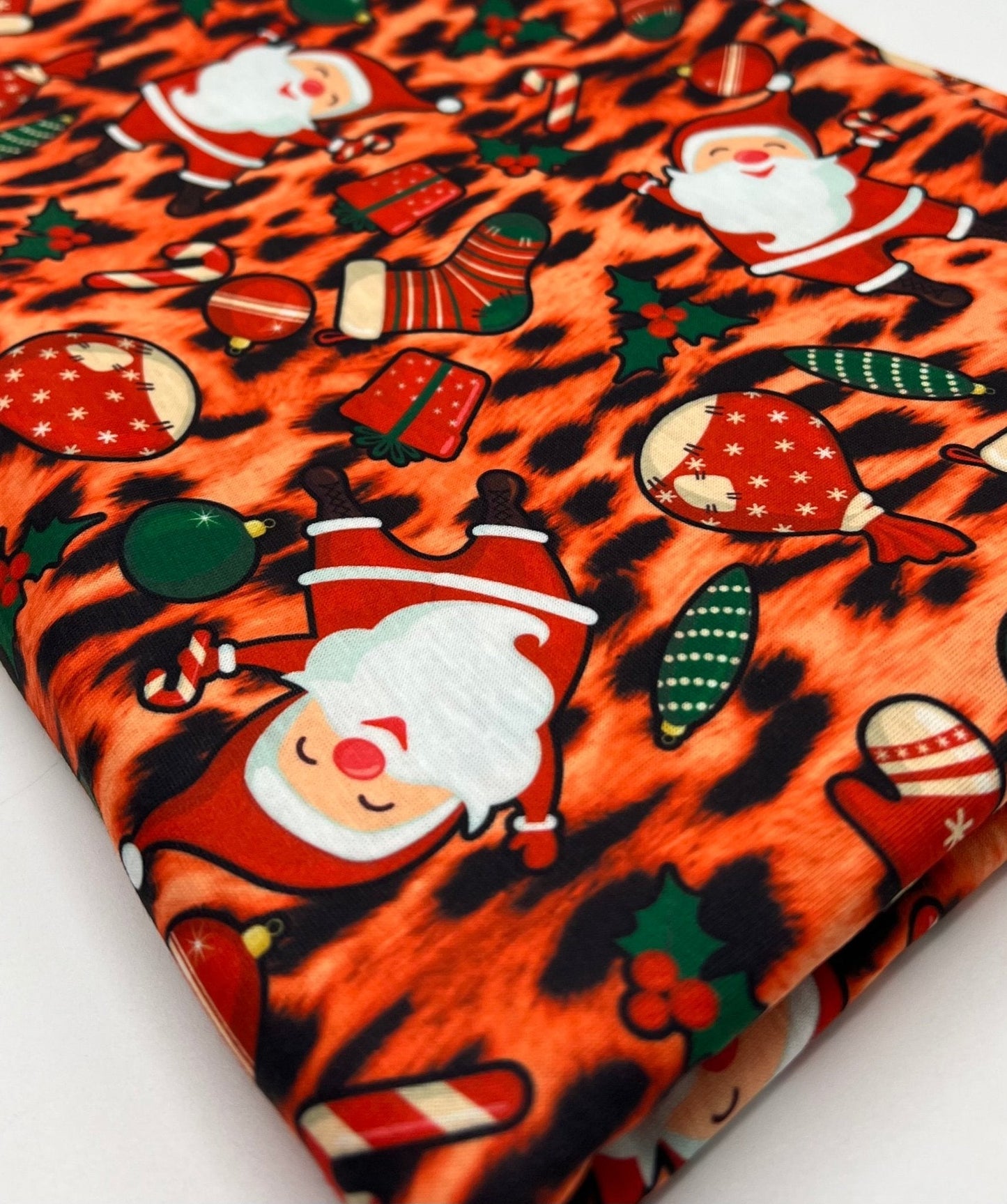Orange Animal Santa Print Soft Spun Poly Stretch Fabric