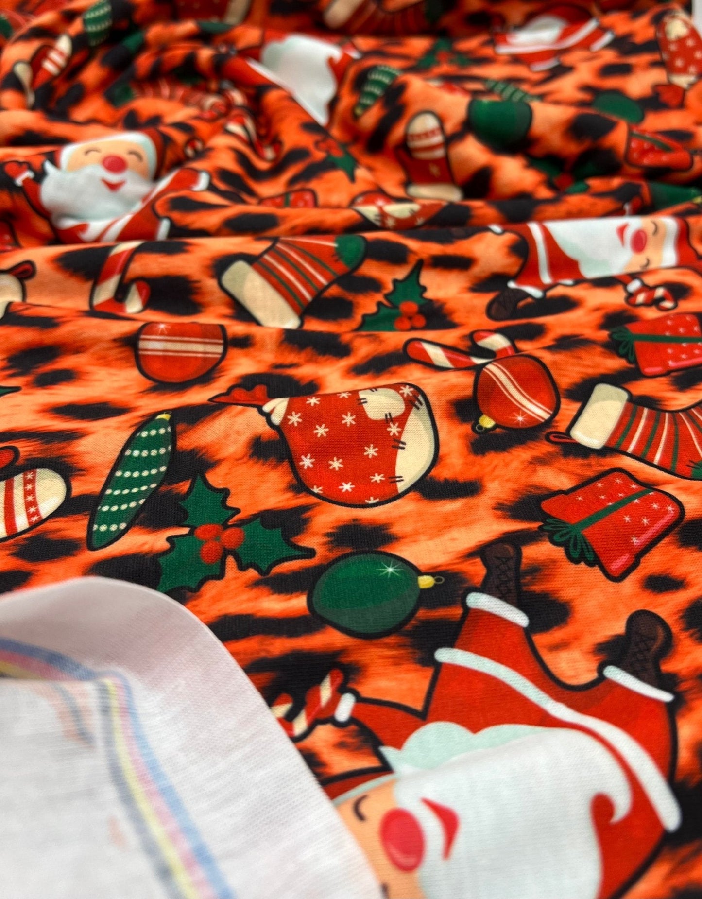 Orange Animal Santa Print Soft Spun Poly Stretch Fabric