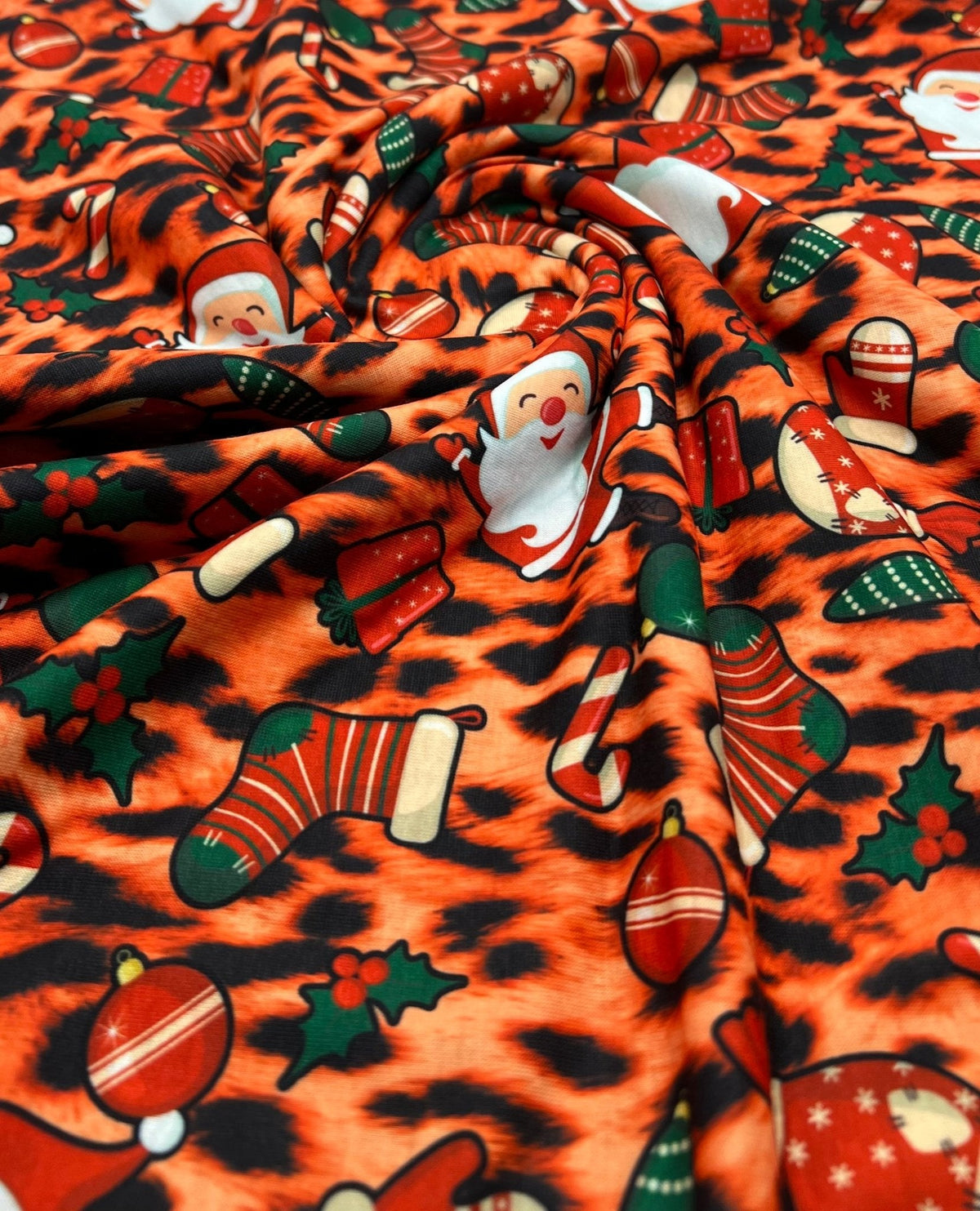 Orange Animal Santa Print Soft Spun Poly Stretch Fabric