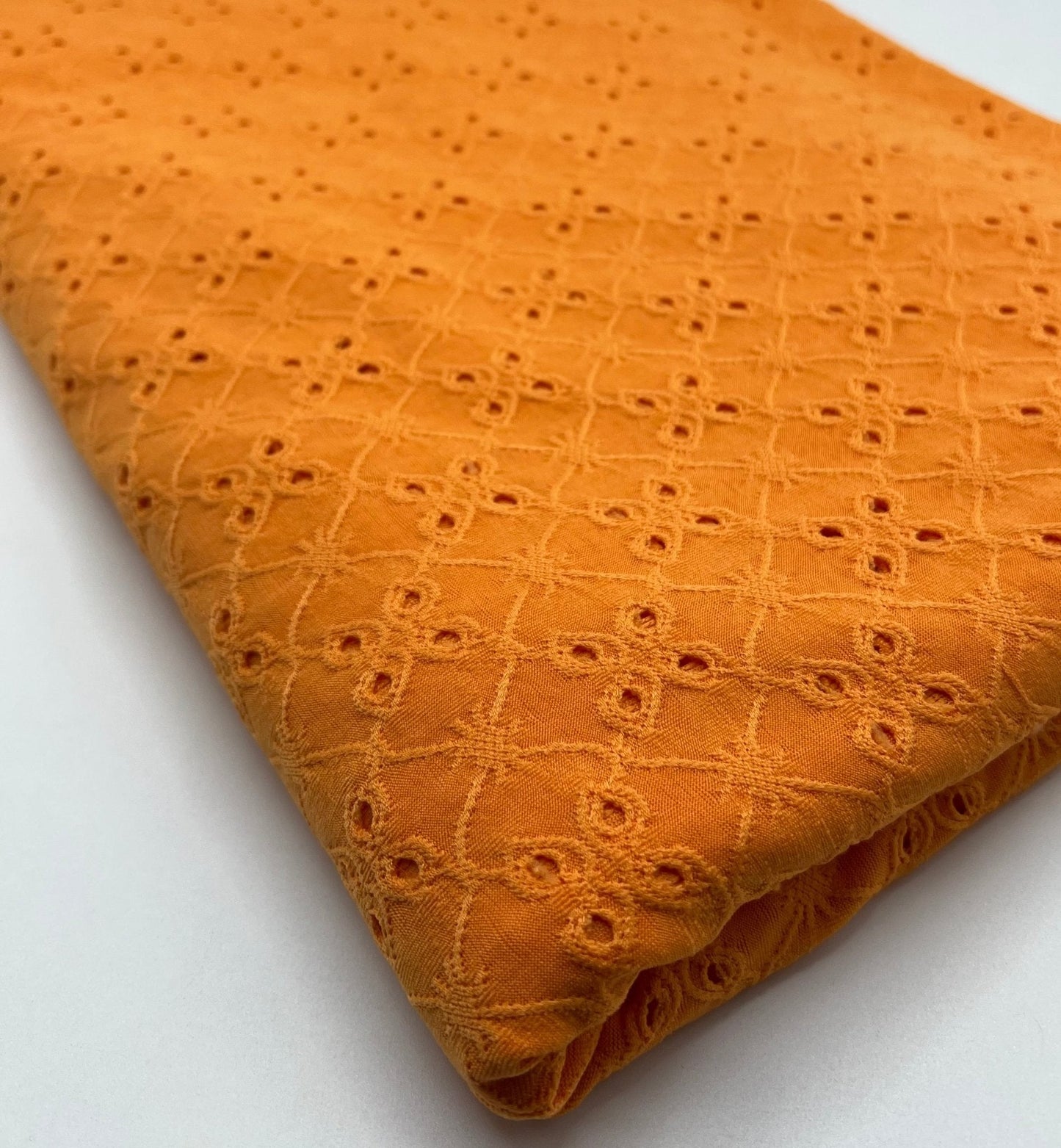 Orange Broderie Anglaise Stretch Fabric 4 Way Stretch Fabric