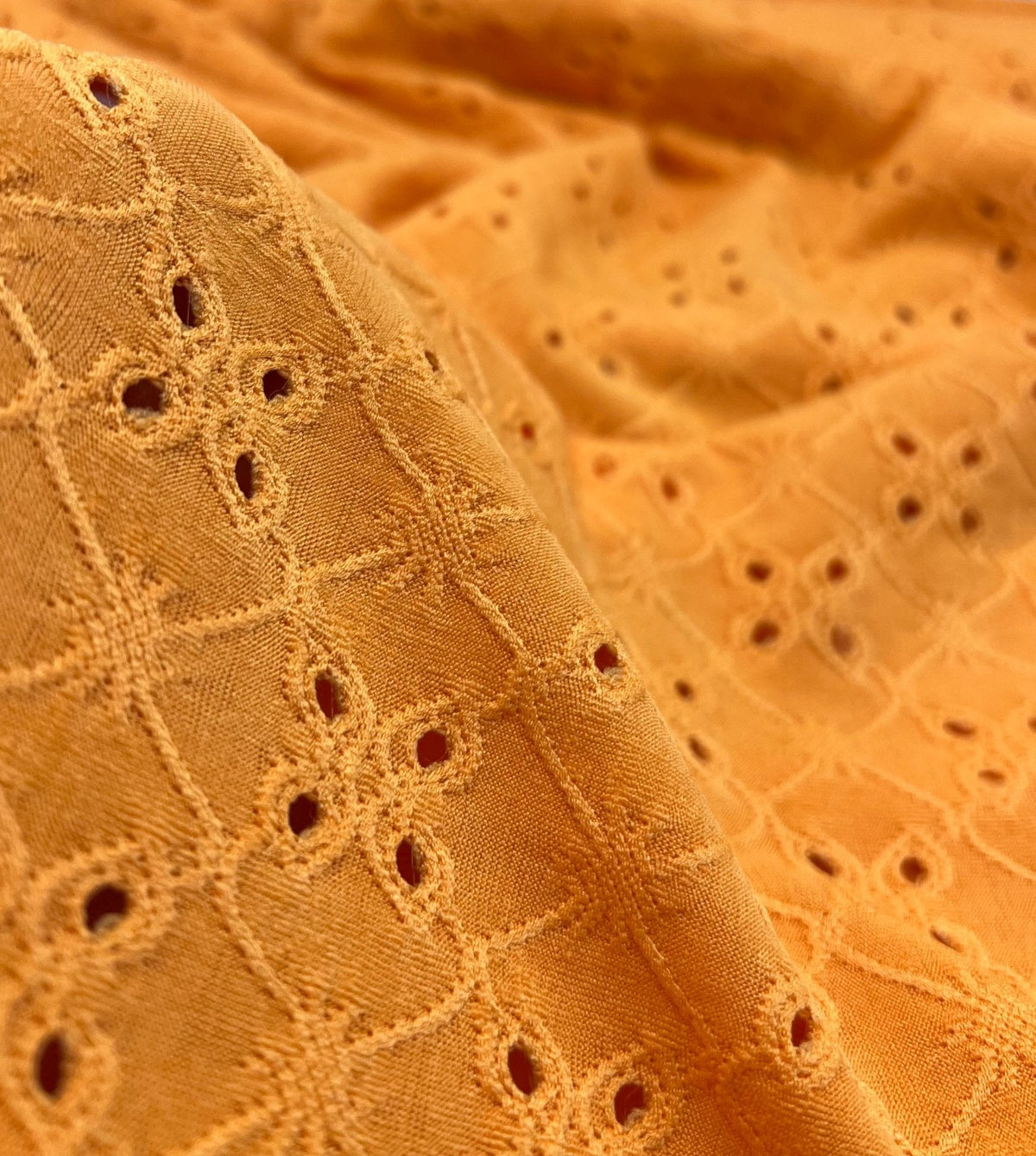 Orange Broderie Anglaise Stretch Fabric 4 Way Stretch Fabric