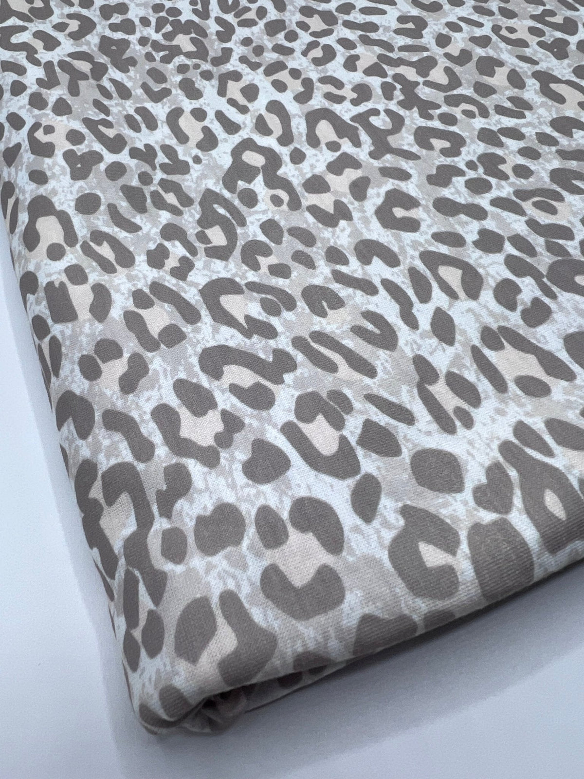 Pale Fade Animal Print Spun Poly Stretch Fabric